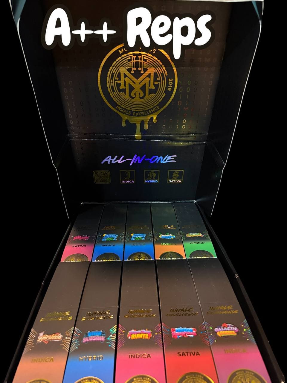 Display box of Inhale Excellence vape products categorized by indica, sativa, and hybrid strains.