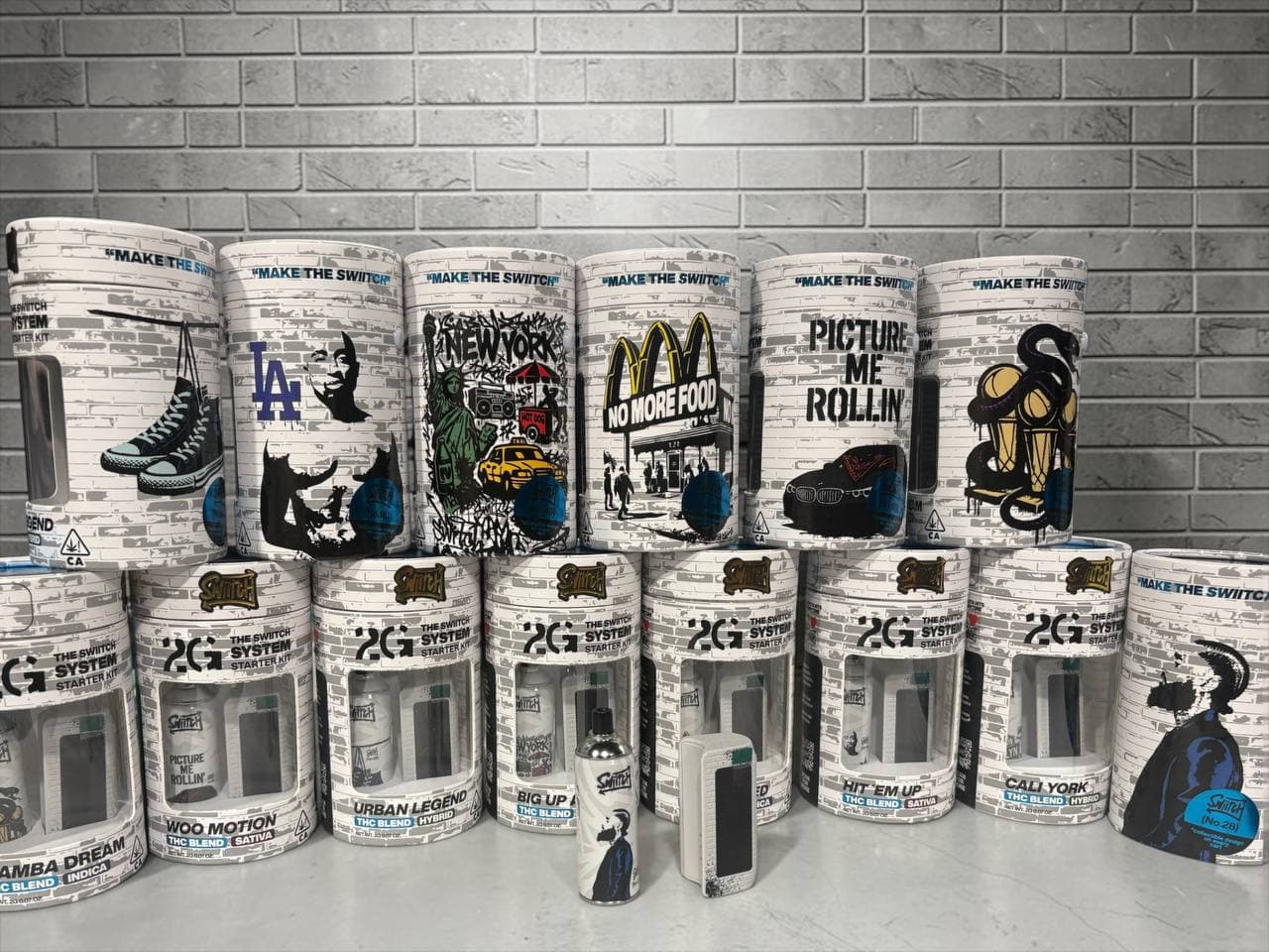 Rows of THC starter kits with white brick designs and urban street art graphics.